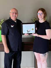 Food Safety 1st, Russell Scott presents Jillian Adam of The Glen at Crossmount the 17,000th Food Safety 1st certificate.
